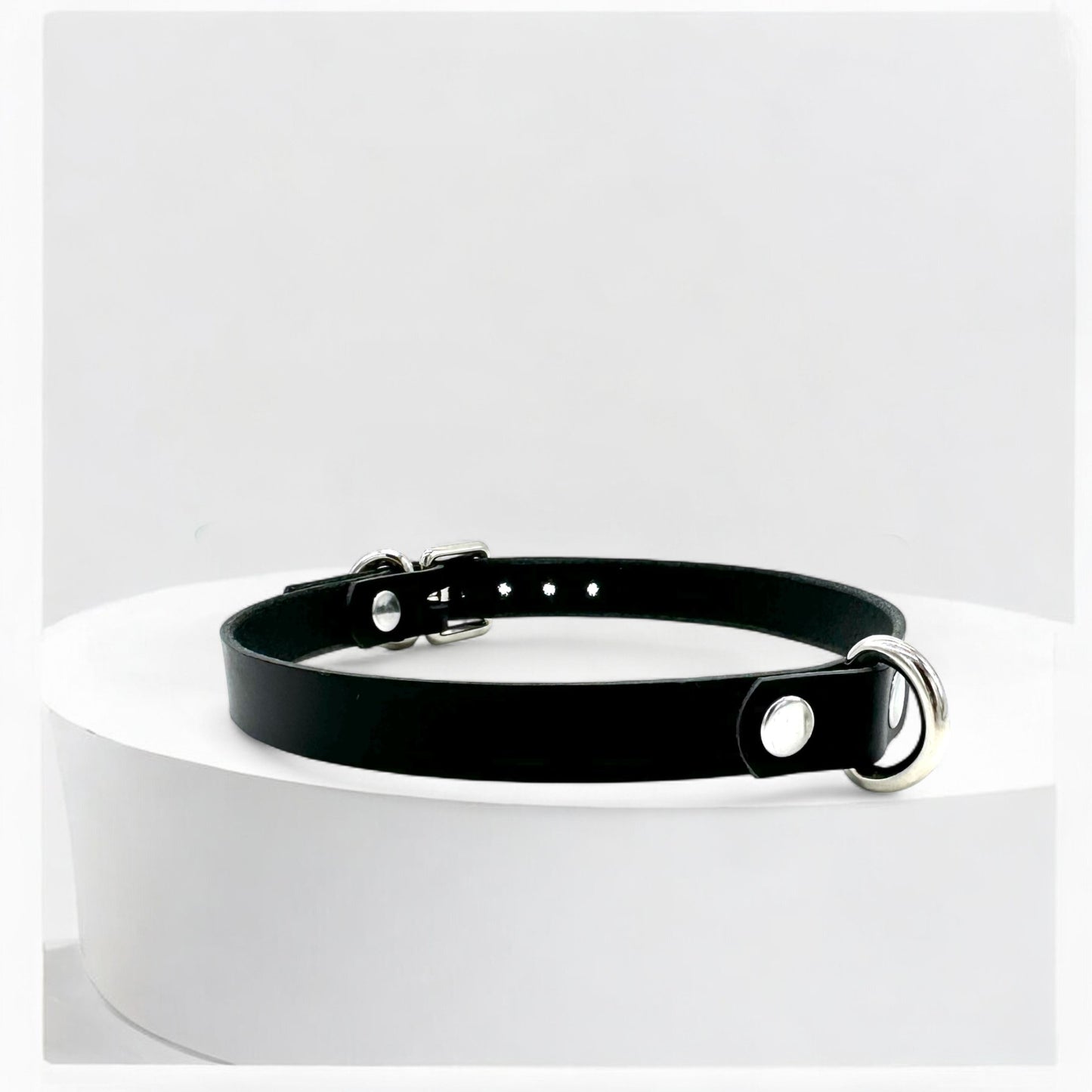 Adjustable black leather choker with silver mini D-ring, handcrafted in USA