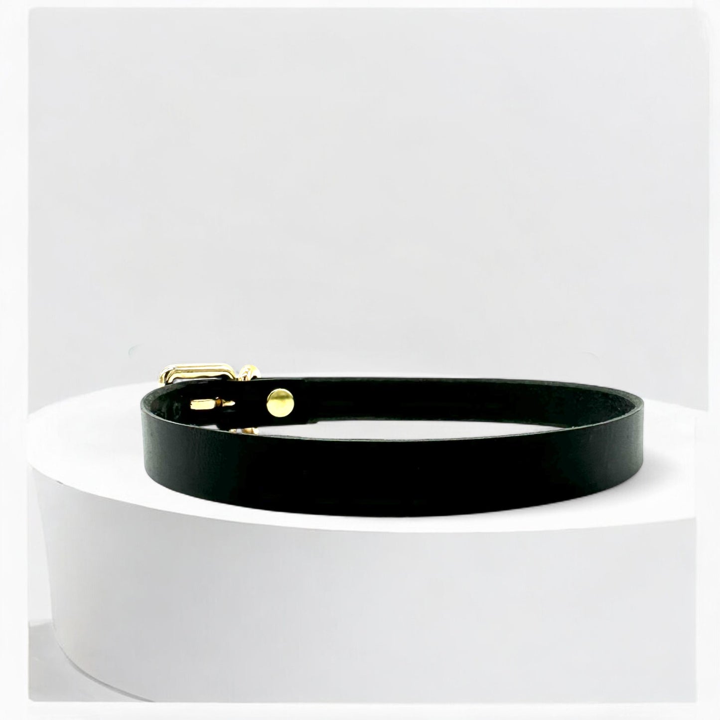 Angled view black leather classic buckle choker with gold hardware