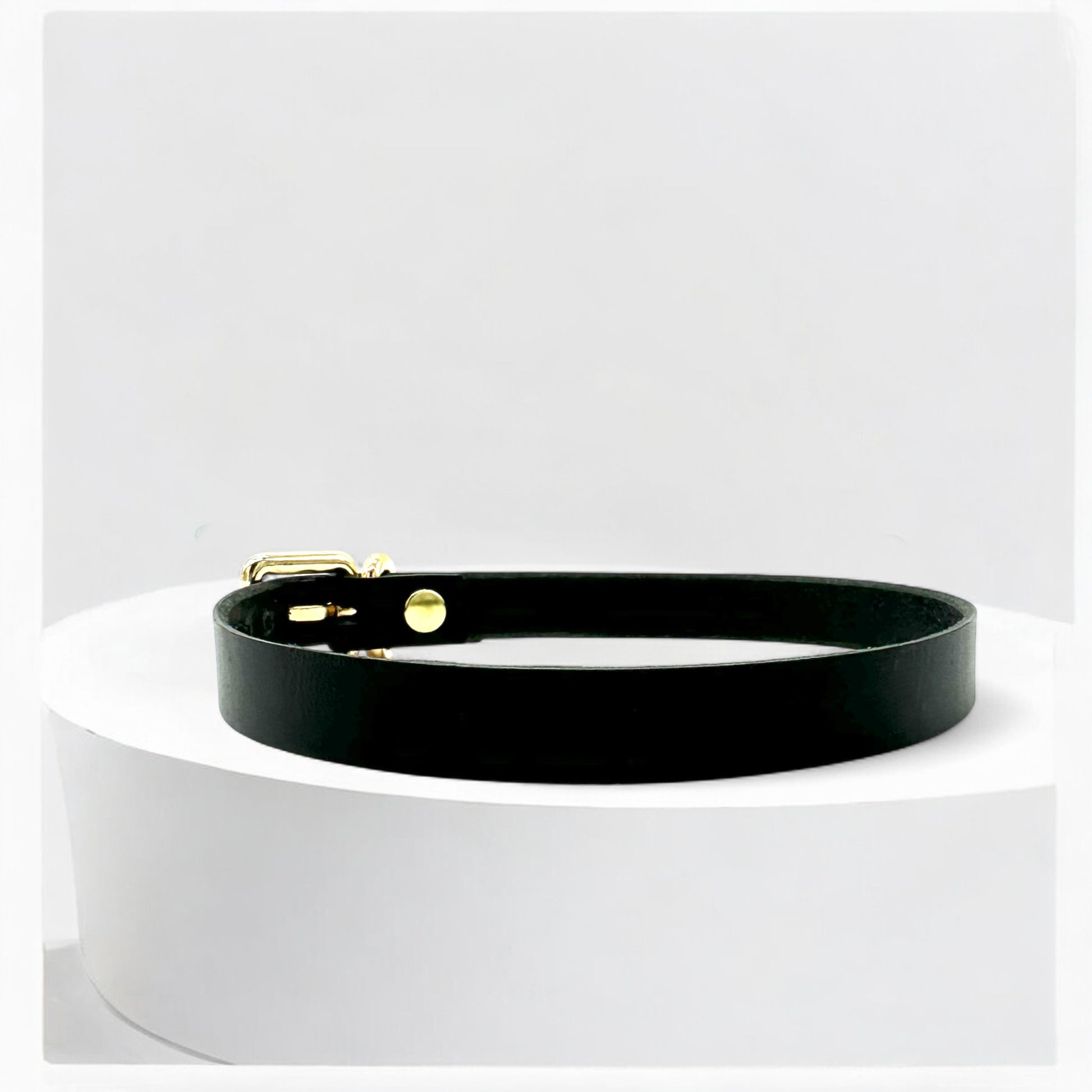 Angled view black leather classic buckle choker with gold hardware