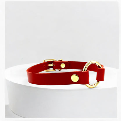 Angled view red O-Ring leather choker with gold hardware detail