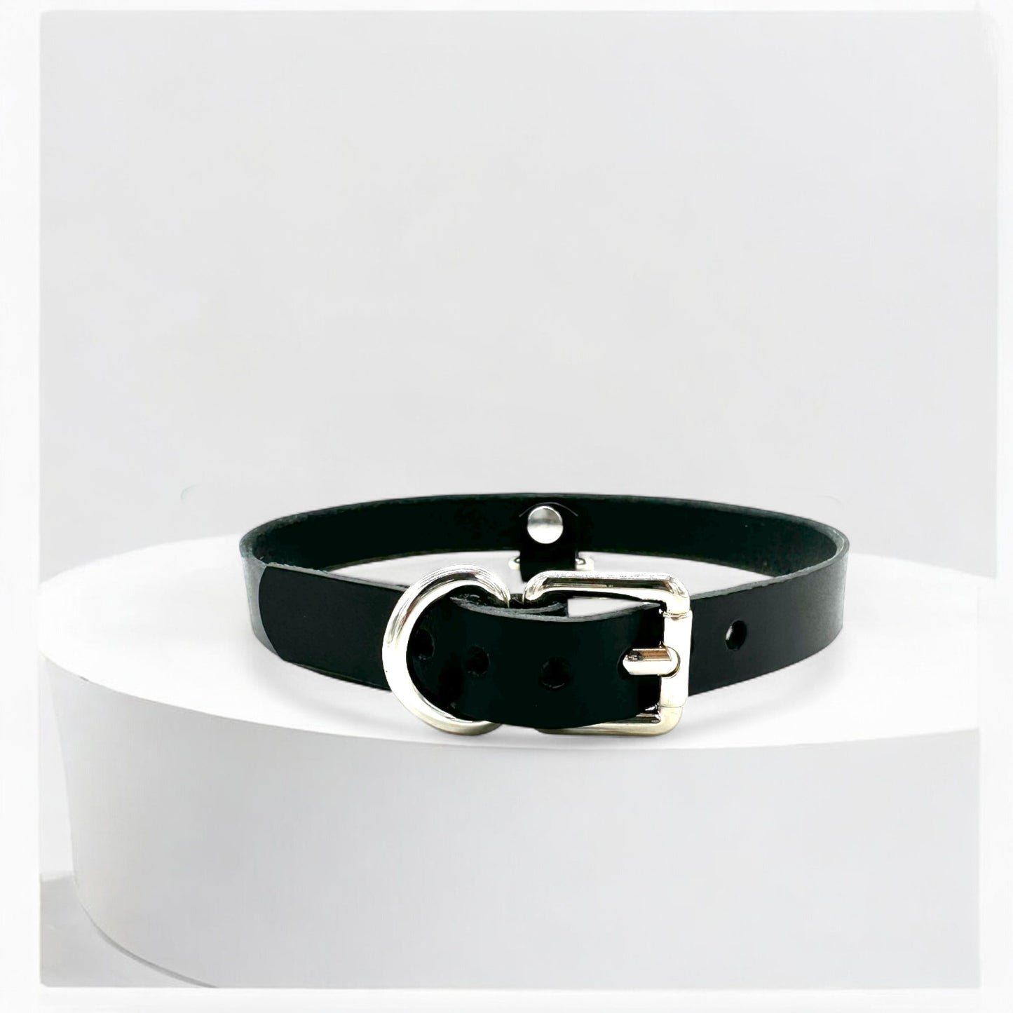 Flat lay of black Drop Mini D-Ring Choker on white background