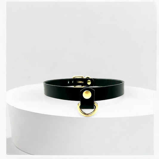 Close-up of black Italian leather Drop Mini D-Ring Choker with silver details