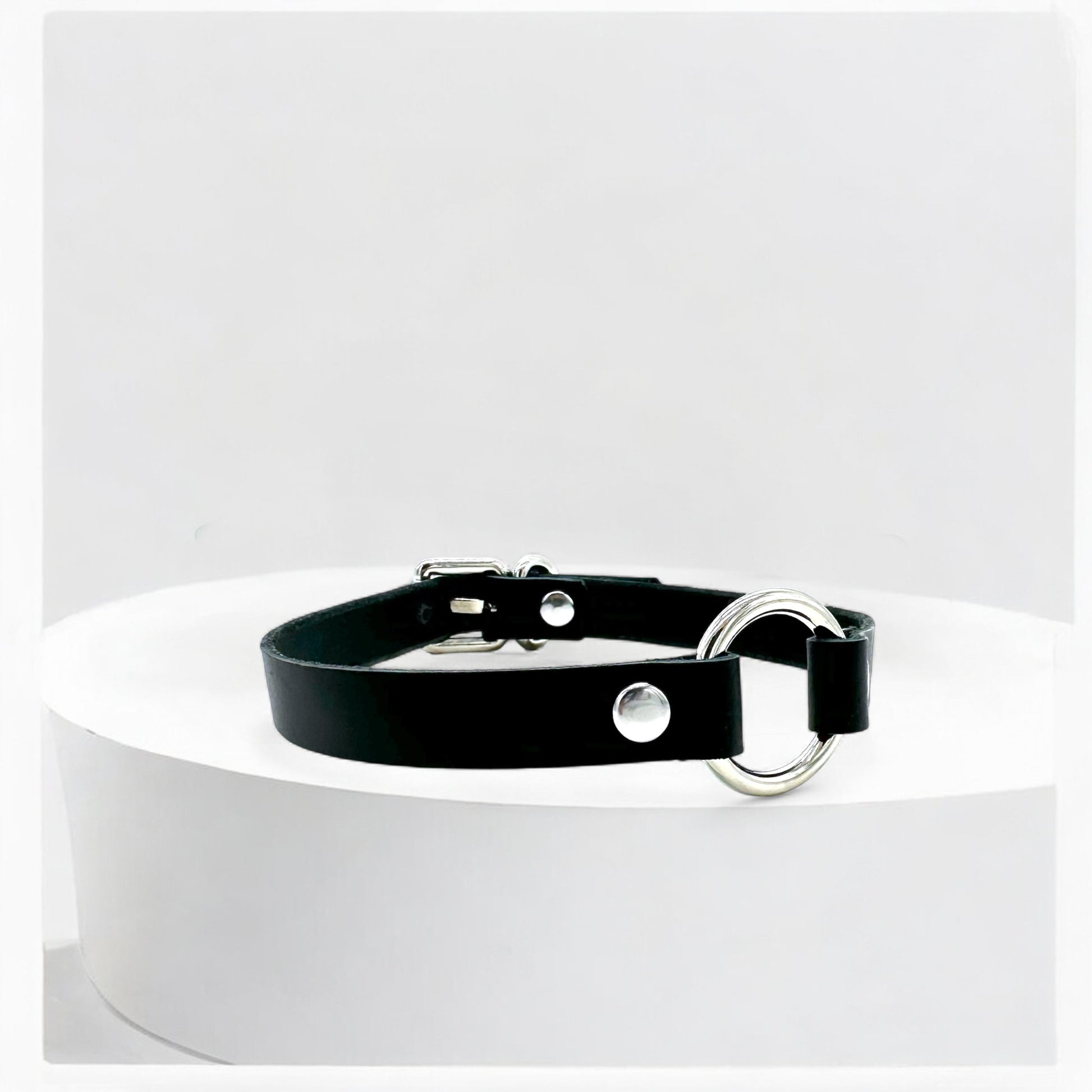 Close-up black leather O-Ring choker with silver ring detail