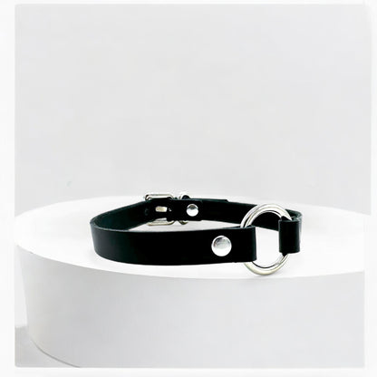 Close-up black leather O-Ring choker with silver ring detail