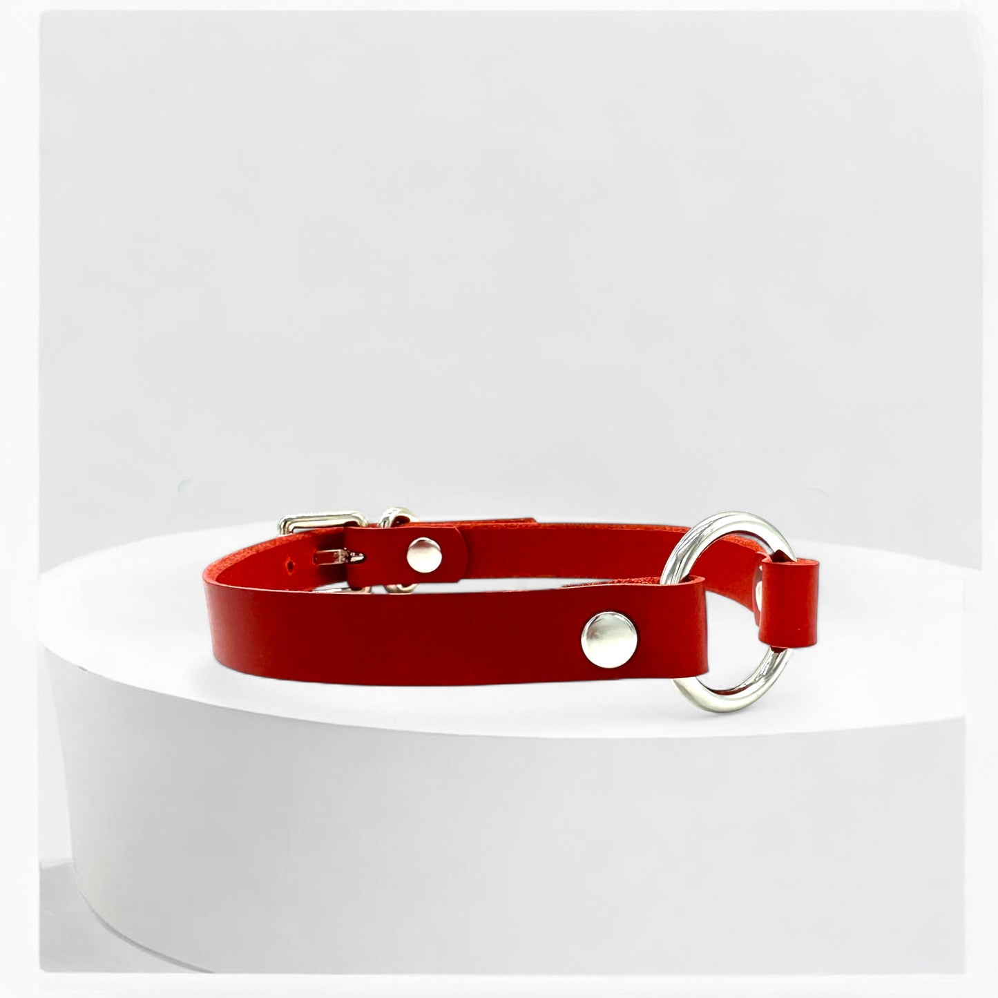 Close-up red leather O-Ring choker with silver ring detail