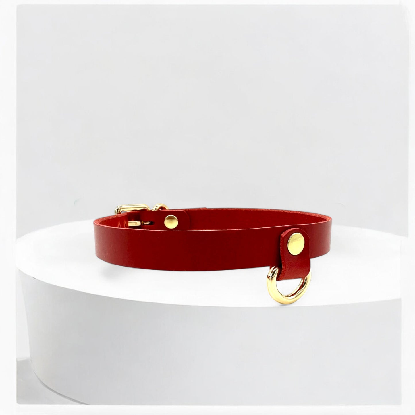 Side angle of red Drop Mini D-Ring Leather Choker showing slim design